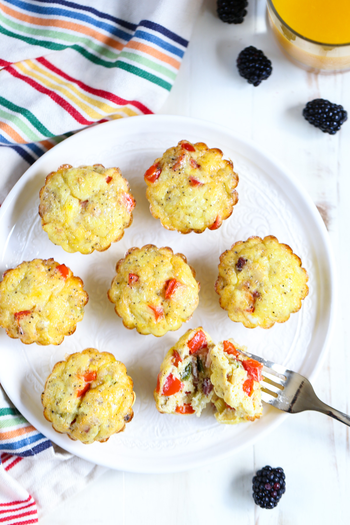 Egg muffins, or omelet cups, on a white plate.