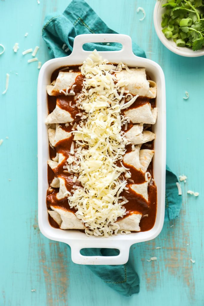 Simple homemade enchiladas made with chicken and cheese, and a homemade enchilada sauce.